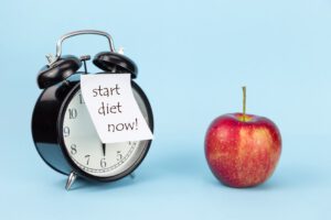 תפוח ושעון מעורר - המתאר שהזמן להתחיל דיאטה הוא עכשיו